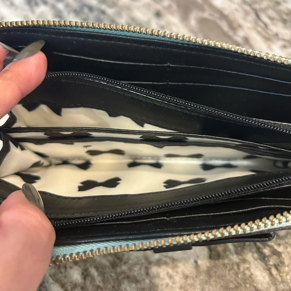 Kate Spade Chelsea park mint Wallet with Bow Accents has wear stains